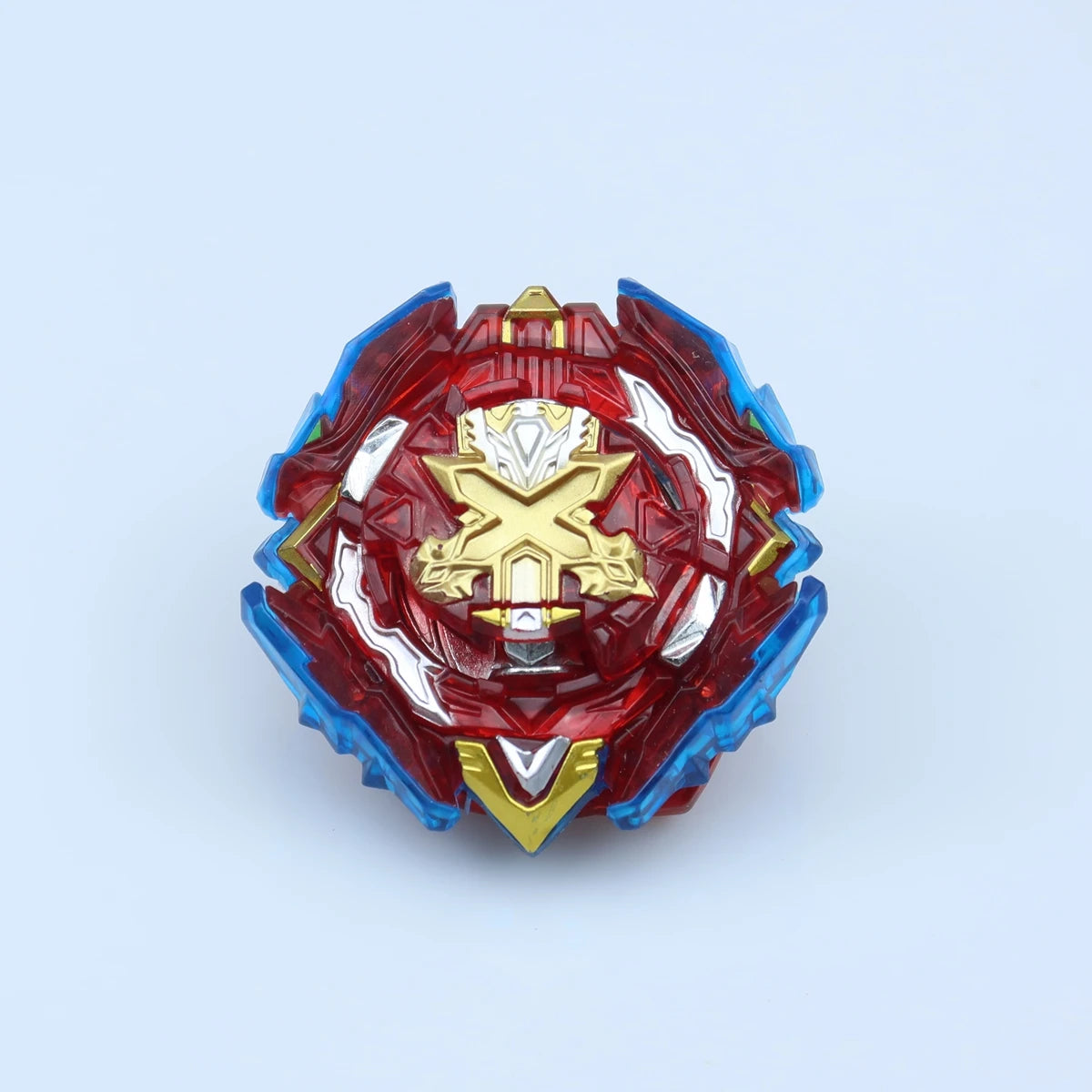A metallic red and blue spinning top featuring a gold cross design.
