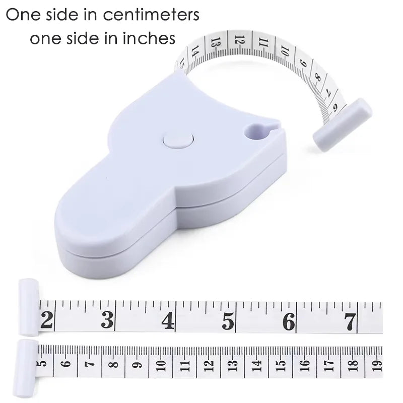 A white automatic retractable body measuring tape with a ruler and inch markings shown next to a ruler.