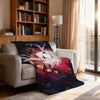 A throw blanket featuring a colorful, dramatic illustration of Pierrot in a circus theme draped over a light-colored sofa.