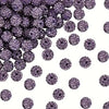 A pile of small, round, purple crystal clay beads for DIY jewelry and craft projects.