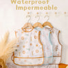 A set of waterproof baby bibs in white and light blue featuring cute animal patterns displayed on a wooden hanger.