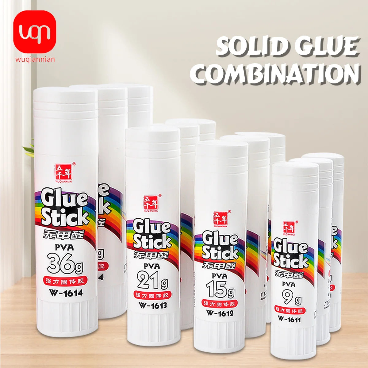 A collection of white Glue Stick products with various sizes and PVA materials displayed on a wooden surface.