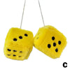 Yellow plush velvet dice shaped pendant hanging by a silver chain