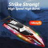 A red high-speed RC speedboat with bright LED lights is shown in flight over the water.