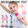 A young girl holds a pink microphone toy with light effects, demonstrating a portable karaoke machine.