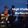 A worker wearing a reflective vest is holding a laptop in a dark, urban night setting.
