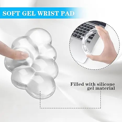 A clear, cloud-shaped silicone gel wrist pad is shown next to a laptop keyboard.