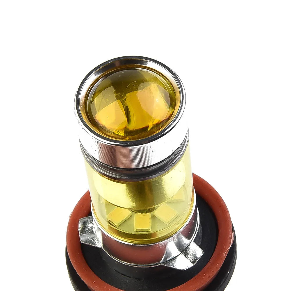 A close-up view of a yellow LED fog light bulb with a metallic base and rubber seal.