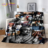 A throw blanket featuring black and white photographs of Eminem and 2Pac hip-hop icons.