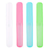 Three clear and colored travel toothbrush cases in white, pink, and light blue.