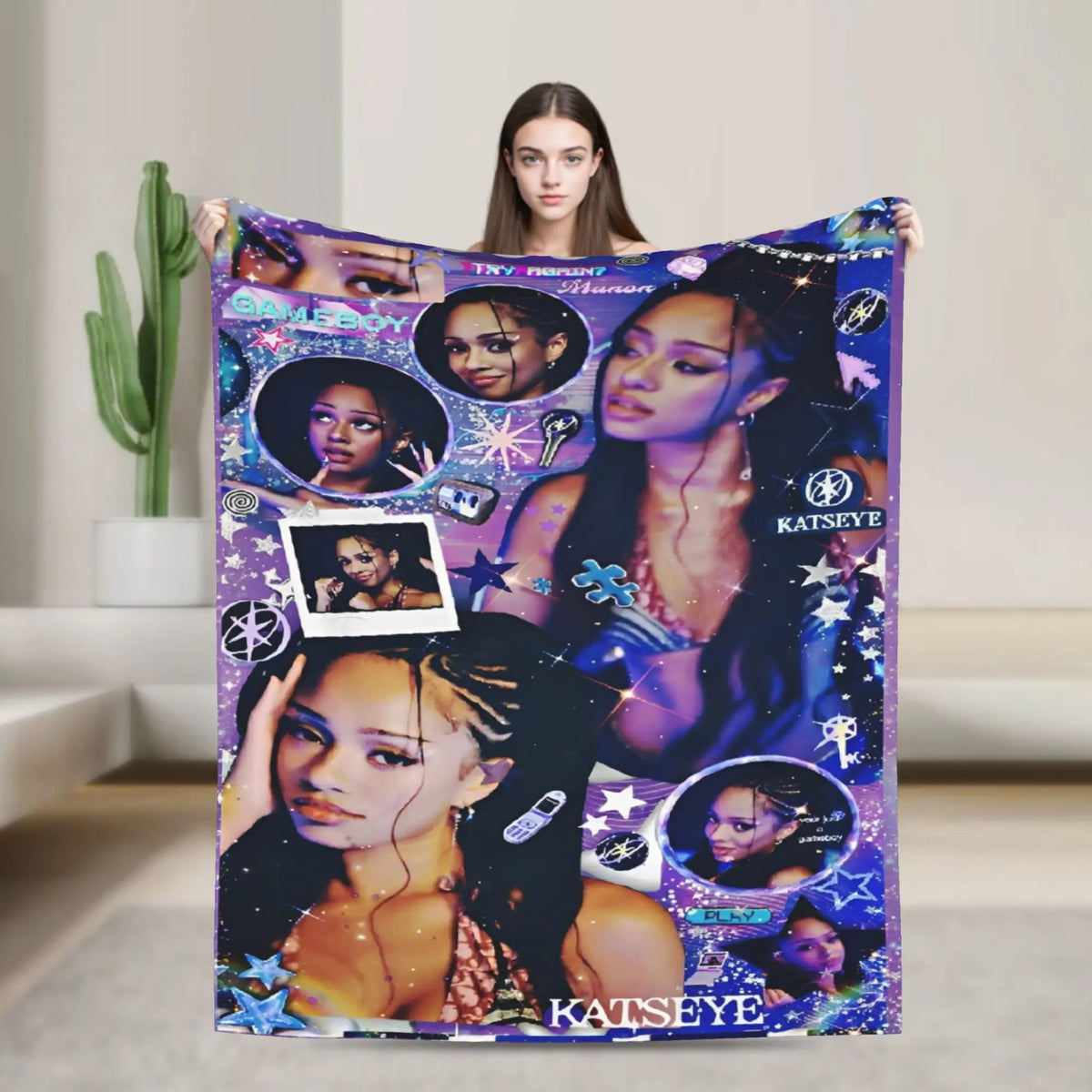 A purple and black patterned fleece throw blanket featuring various stylized portraits of a woman.