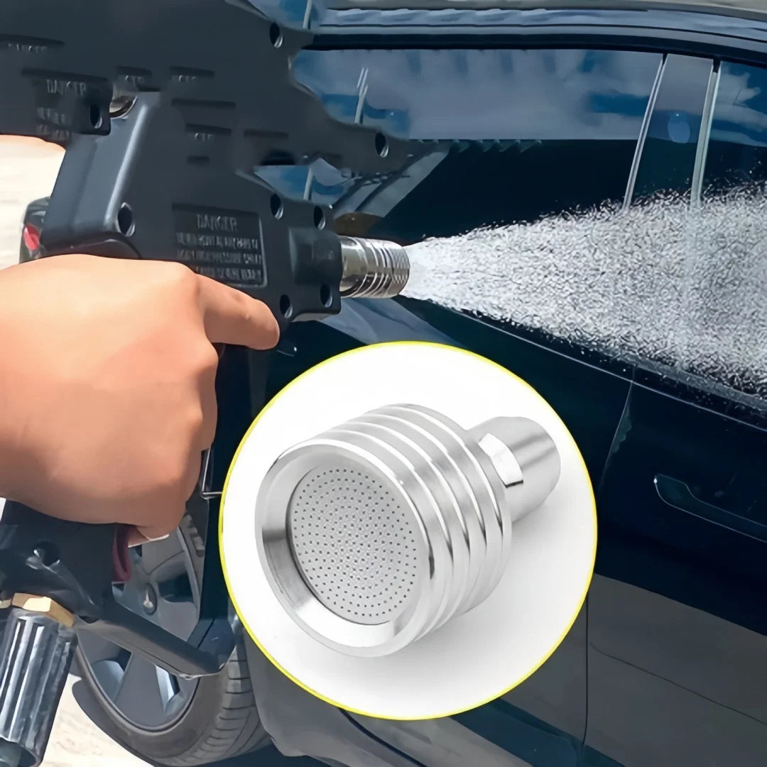 Stainless steel high-pressure washer nozzle with 1/4 quick connect being used on a car surface.