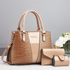 Beige Crocodile-Musteres Patentlederhandtasche-Set mit großer Tasche und Clutch.