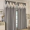 Gray sheer curtains with decorative lace trim hanging in a doorway