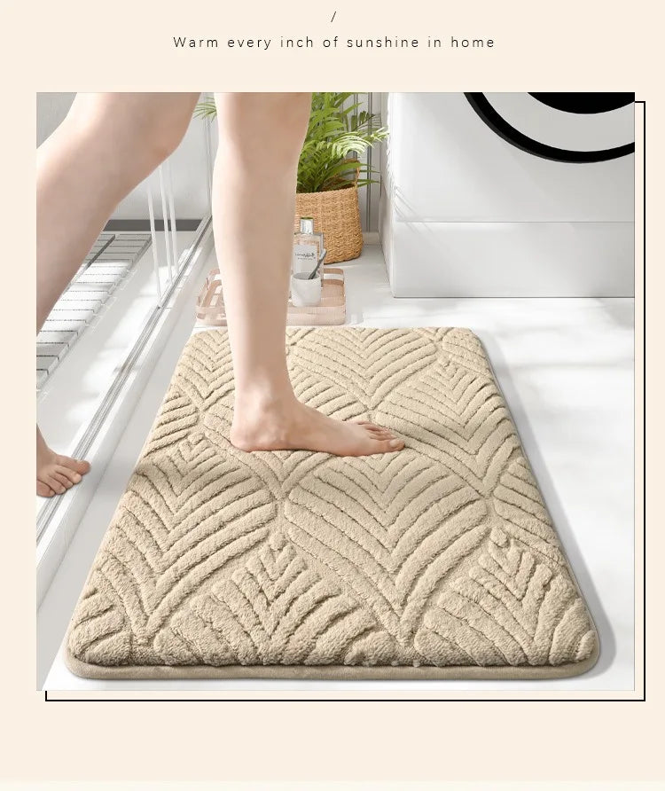 A beige plush velvet bathroom mat with a diamond pattern is placed on a white floor.