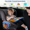 A toddler is playing with a colorful Montessori giraffe busy board and quiet book inside a car seat.