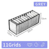 A grey foldable closet organizer box with 11 grids for storing underwear, socks, and accessories.