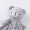 A soft lavender stuffed animal with a face and a floral patterned fabric body.
