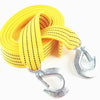Yellow heavy-duty vehicle recovery towing strap coiled and with metal hooks