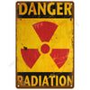 Vintage metal tin sign with yellow background and red radiation symbol and the word DANGER RADIATION