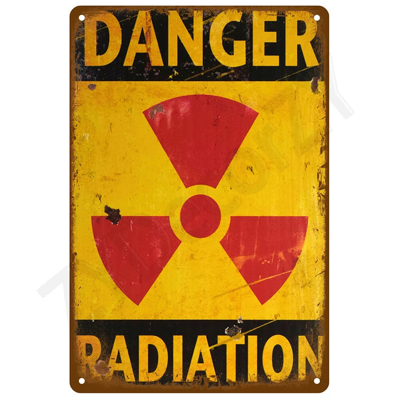 Vintage metal tin sign with yellow background and red radiation symbol and the word DANGER RADIATION