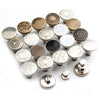 A collection of various metal snap buttons and hardware components for instant no-sew jean repairs.