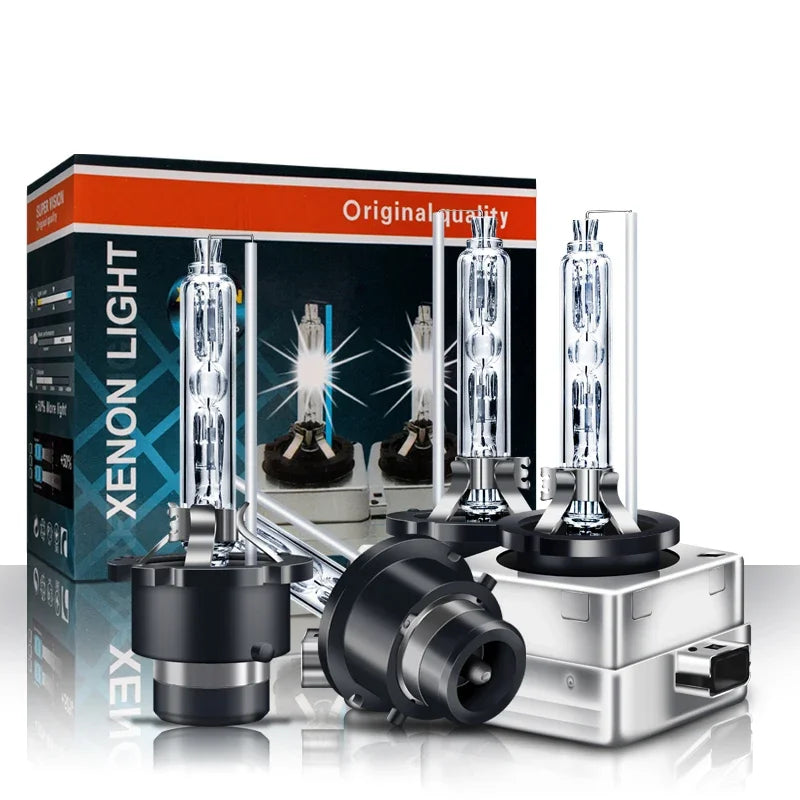 A box and pair of HID Xenon headlight bulbs displayed on a silver base.