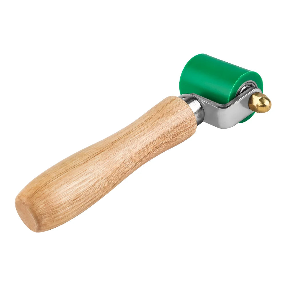 A silicone seam roller tool with a wooden handle and a green roller for welding and waterproofing.