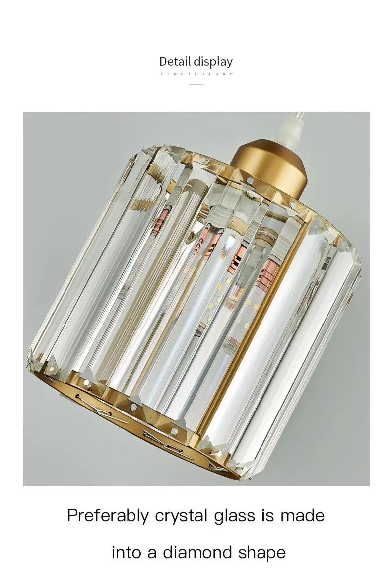 A diamond-shaped crystal glass pendant light with a gold iron frame.