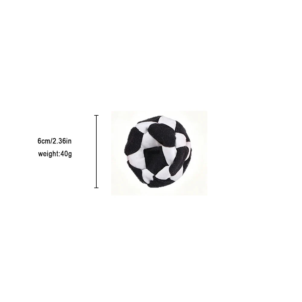 A hand-knitted crochet hacky sack ball in black and white.