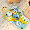 A wooden farm animal assembly toy featuring various animals, a screwdriver, and a wrench on a light blue board.