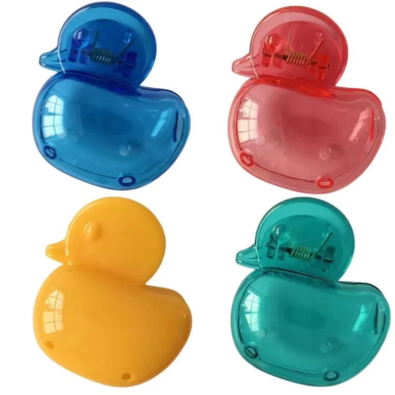 Set of four portable toothbrush head covers in blue, red, yellow, and teal with clips