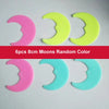 Six 8cm moons in random colors pink yellow and light blue glow-in-the-dark wall stickers