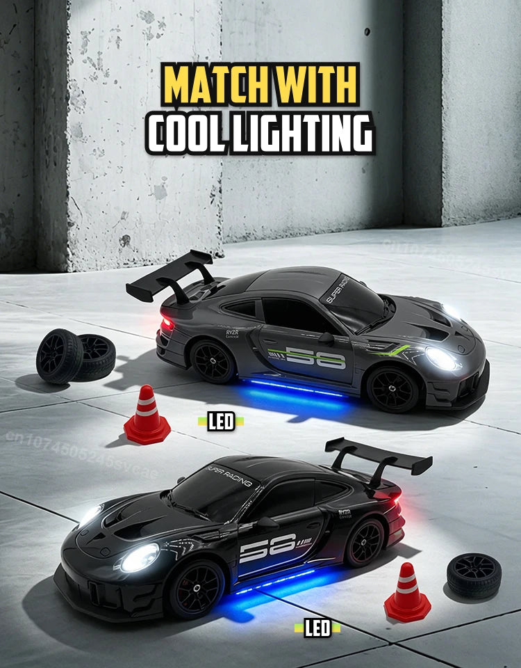 A black RC drift truck is illuminated by blue LED lights in a studio setting.