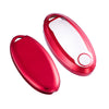 A red silicone key fob cover for a Nissan vehicle, shown in an open and closed state.