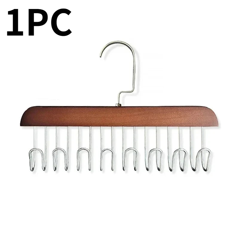 A wooden hanging clothes rack with multiple metal hooks for hanging clothes.