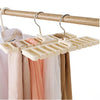 A wooden hanger rack with multiple plastic hooks used to organize belts and ties.