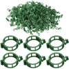 A pile of green reusable plant clips for garden support and vine fixing