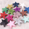 A collection of five glitter star-shaped iron-on embroidered patches in various colors including blue, gold, green, purple, a