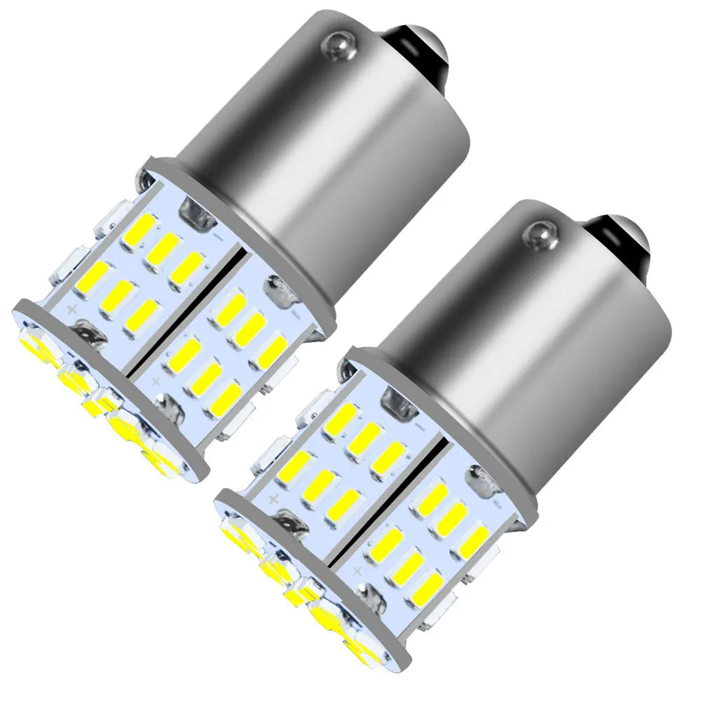 A pair of silver LED bulbs designed for brake, reverse, and turn signals.
