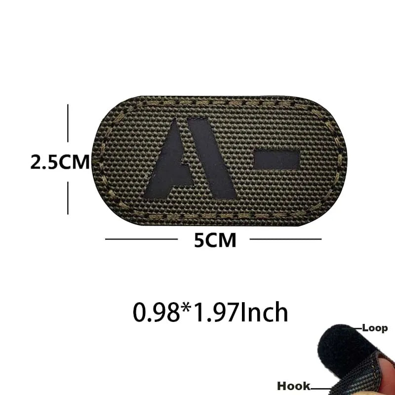 A rectangular, dark olive green glow-in-the-dark tactical patch with a hook and loop backing.