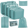 A set of teal travel packing cubes and storage bags for organizing items.