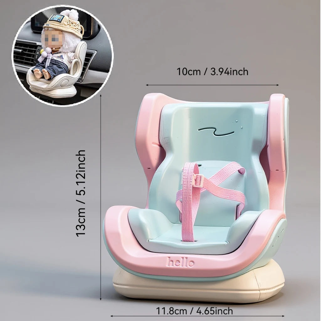 A pink and mint colored car seat accessory for a baby, featuring a storage clip and a plush toy.