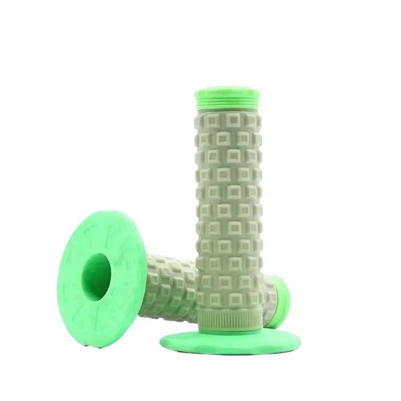A set of bright green motorcycle pillow top grips for handlebars.