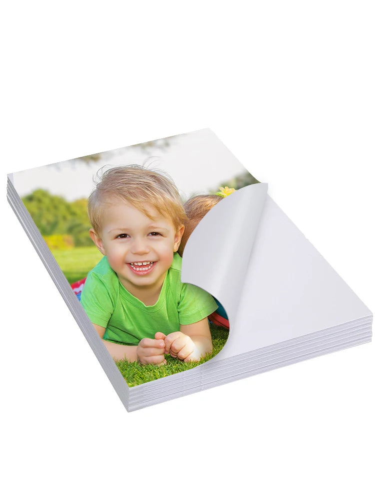 A photo of a smiling toddler outdoors is shown on glossy self-adhesive inkjet photo paper.