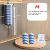 A set of disposable toilet brush kit components including a middle brush base, sponge heads, and wall sticker displayed next 