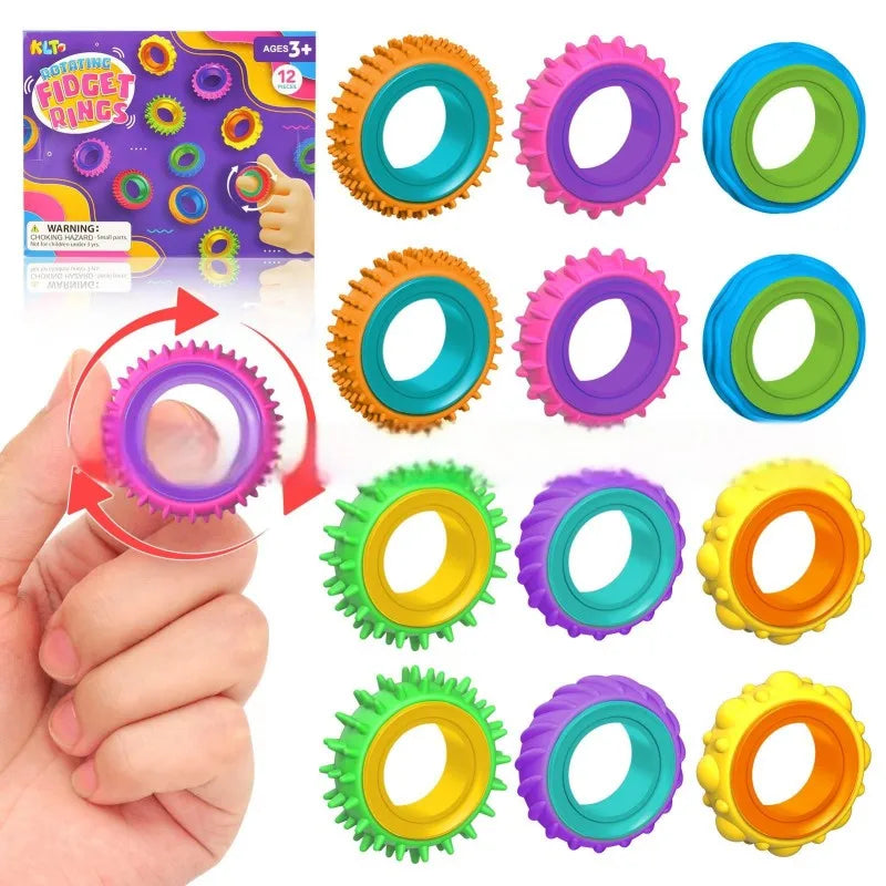 A hand holds a silicone fidget ring in various colors, demonstrating the product for stress relief.