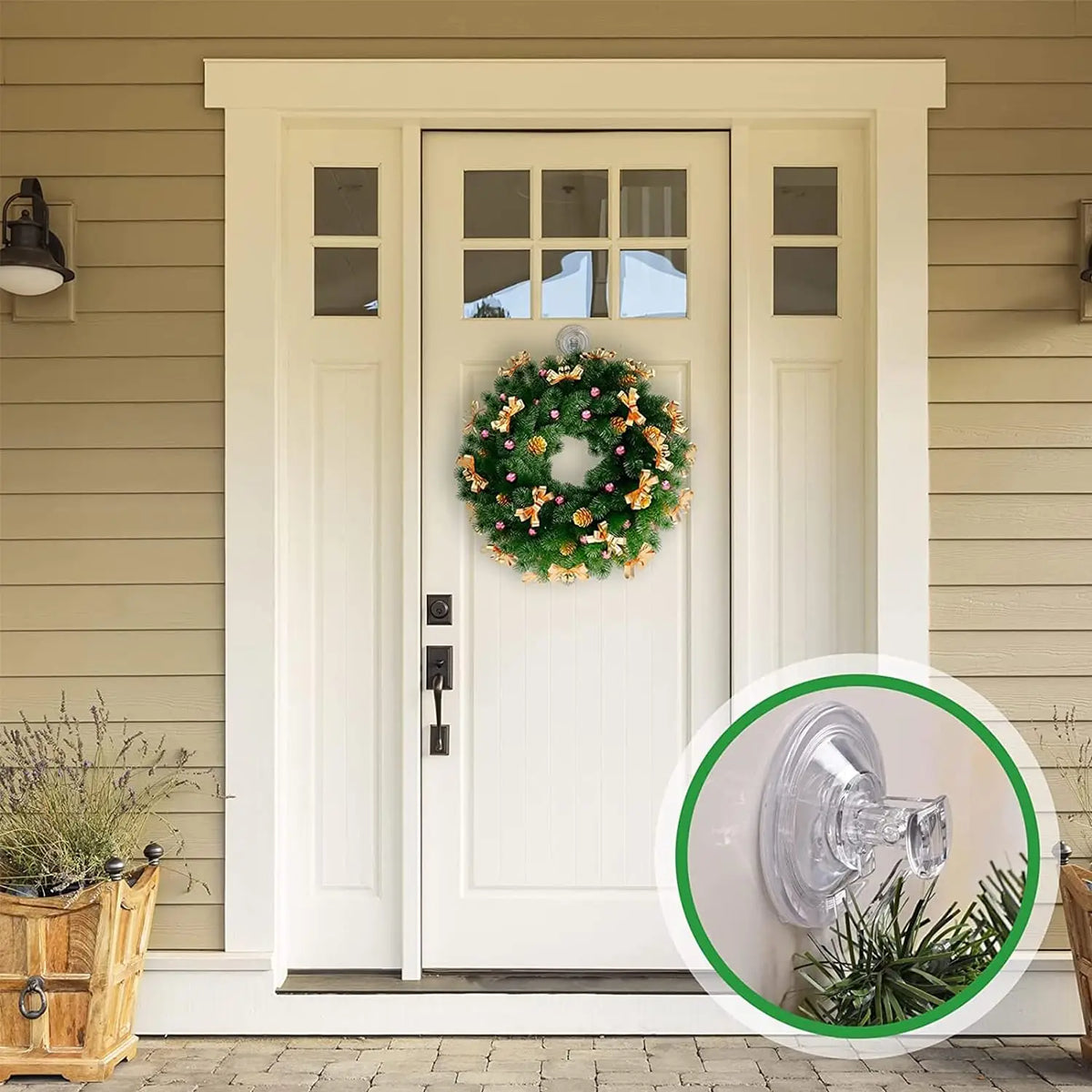 A white door with glass panels decorated with a green floral wreath, featuring heavy-duty transparent suction cup hooks.