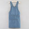 A denim blue cross-back apron with chest pockets and a front pocket, displayed on a hanger.