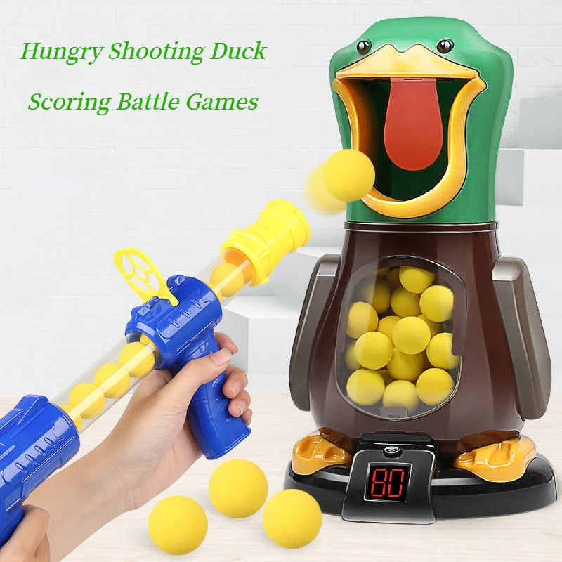 A hand holds a blue dart gun aiming at a green duck target game with yellow darts.